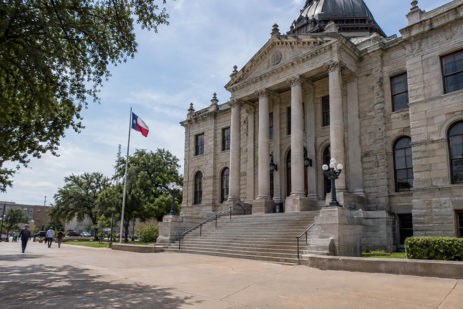 Texas county courthouse exterior with stone steps and columns